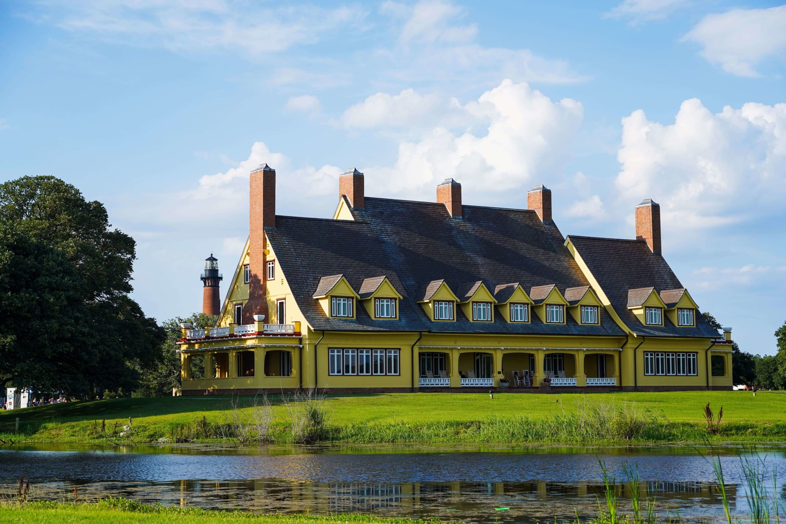 Yellow historic home sitting by the river