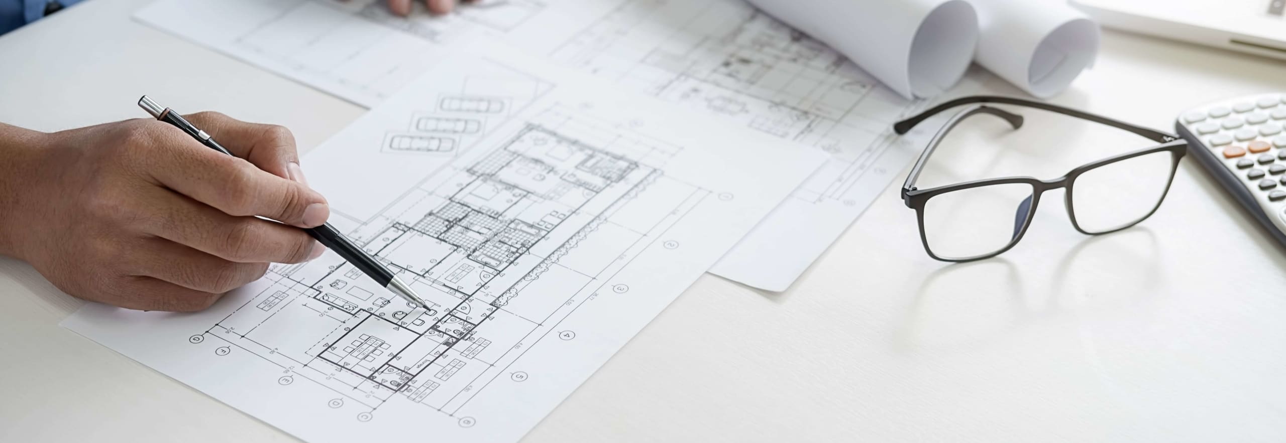 Architect designing blueprints for a historic home restoration project