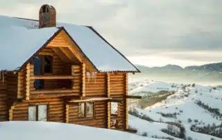Colorado mountain home covered in snow
